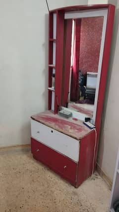 red coloured dressing table