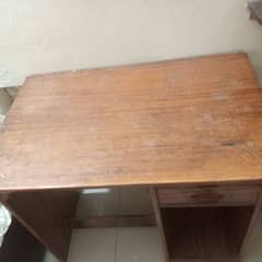 it is wooden table . but it is used .