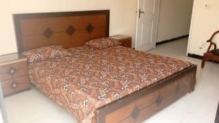 Double bed with new mattress and side tables