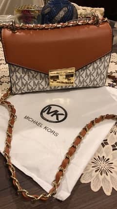 Michael Kors Cross Body Bag in Signature Vanilla.