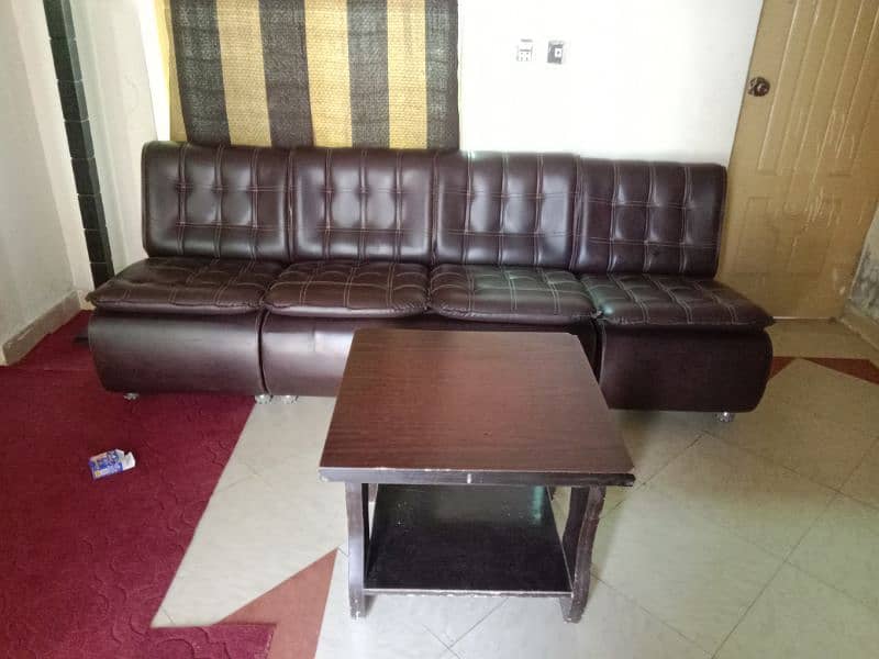 two 4 seter sofa with table 0