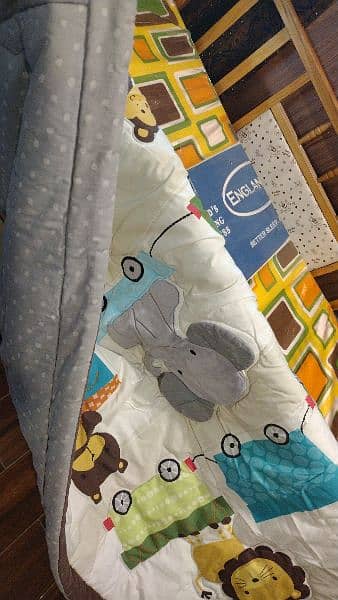 wooden baby cot with new mattress and bedcover and quilt 4