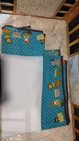 wooden baby cot with new mattress and bedcover and quilt 11