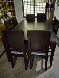 Wooden dining table with 8 chairs