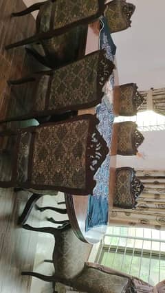 wodden dining table with 8 chairs