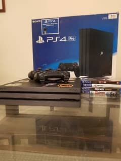 PS4 PRO WITH 4 GAMES FREE AND TWO CONTROLLERS FREE