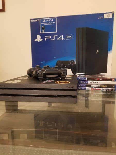 PS4 PRO WITH 4 GAMES FREE AND TWO CONTROLLERS FREE 0