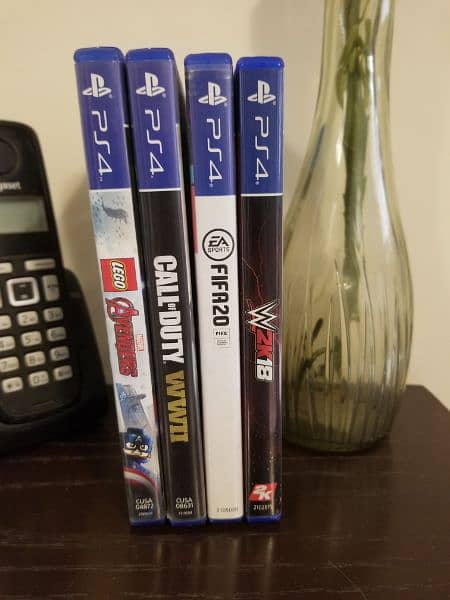 PS4 PRO WITH 4 GAMES FREE AND TWO CONTROLLERS FREE 1