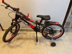Kid's bicycle with training wheels