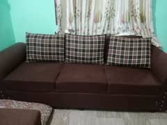 6 seater sofa in brown color in good condition with covers