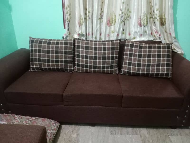 6 seater sofa in brown color in good condition with covers 0