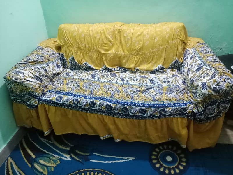 6 seater sofa in brown color in good condition with covers 2