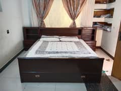 bed with mattress and side table