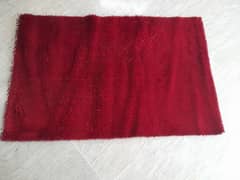 red rug in  good condition