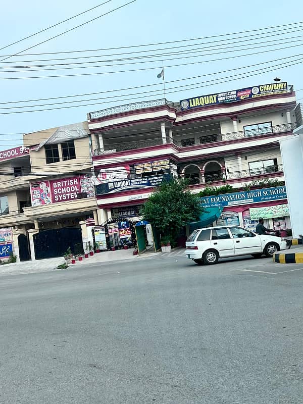 Prime Triple-Story Building for Sale on Main Round Chowk Prior to Main Gate of Marghzar Officers Housing Society with High Rental Income 4