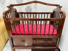 Wooden cot with swing