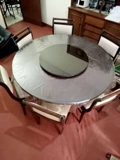 Revolving Disk Glass top Dining Table for Sale