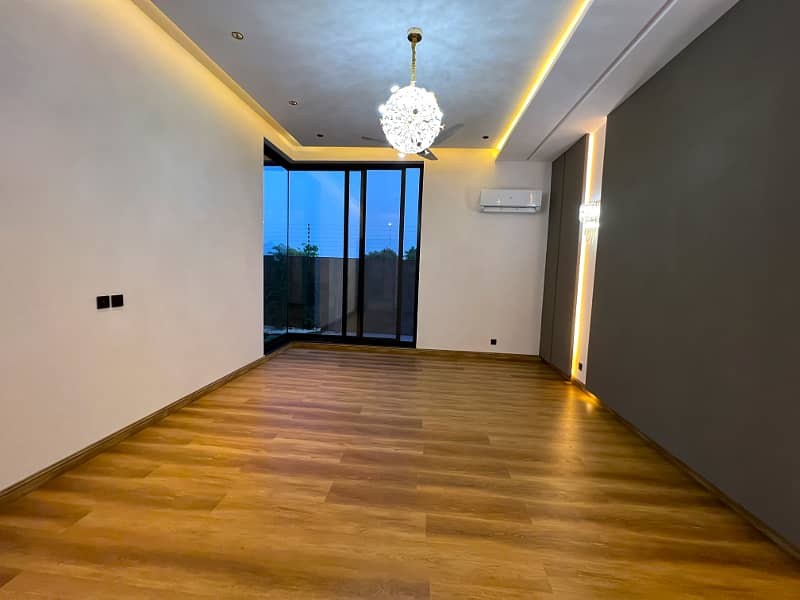 "Magnificent 26.5-Marla Semi-Furnished Bungalow with Spacious Basement, 5 Beds, 7 Baths, 2 Kitchens, and Stylish Living Spaces in DHA Phase 8 Block T - A Must-See Property!" 32