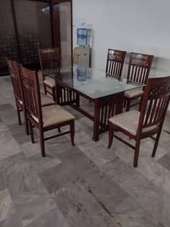 New glass top dining and 6 wooden chairs