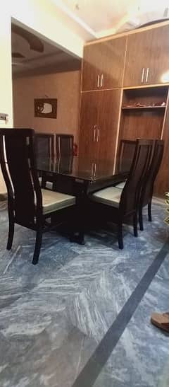 wooden dining table with glass top and 6 chairs