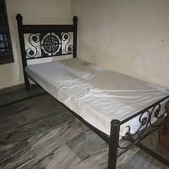 Two iron beds