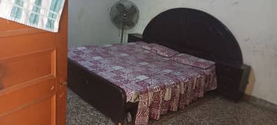 double bed with  mattress and side table