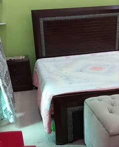Double bed without mattress, side tables and dressing table