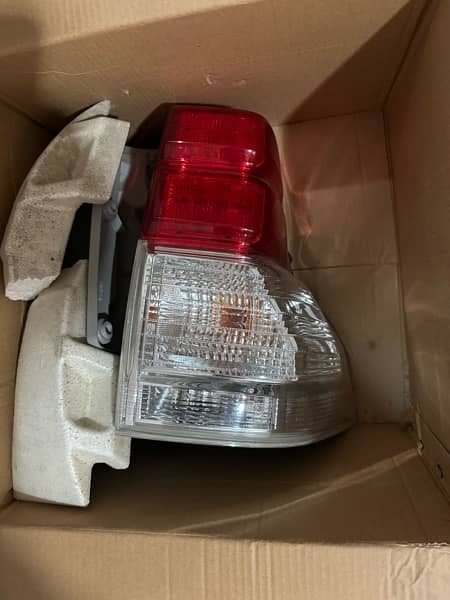 prado 2010 front headlight and tail light pair genuine 0