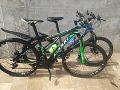 2  IMPORTED MOUNTAIN BIKE  SIZE 29 INCH ALUMINUM GREEN & 26 INCH BLUE