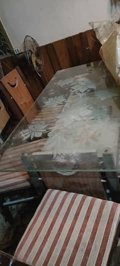 glass top with dining table 6 chairs condition good .