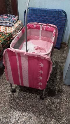 used baby swing and cradle with mosquito net for sale.