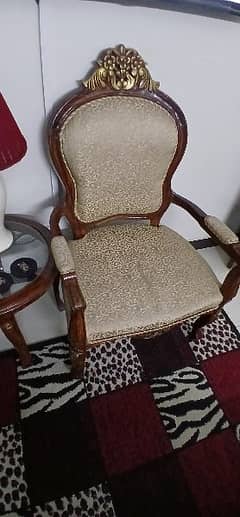 two stylish chairs with 1 coffee table