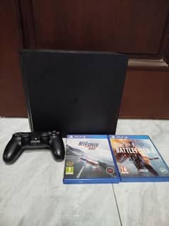 PS4 slim with a two games and a controller
