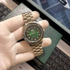 Rolex green dial silver chain