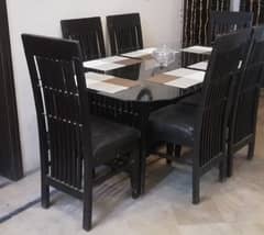 Wooden and Glass Dining Table with 6 Chairs.