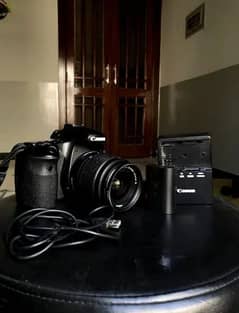 canan 60 with charger batter 50 mm stm lense