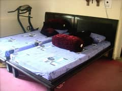 2 single beds (wooden, dark brown)