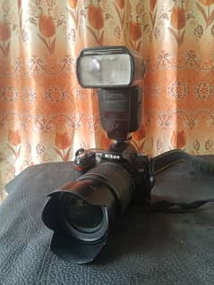 DSLR D90 camera with lens