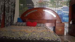 wooden double bed with mattress