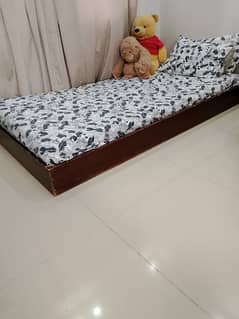 single bed witgout mattress.
