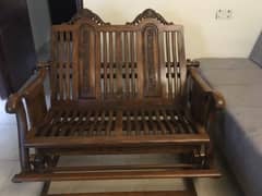 Vintage New rocking/swing chair on walnut wood.