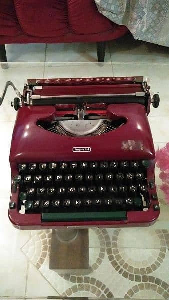 old antique imperial typewriter maroon color 0