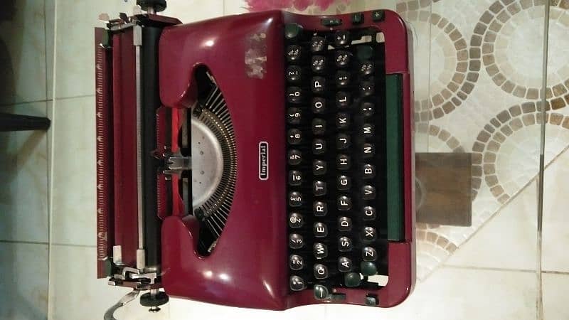 old antique imperial typewriter maroon color 1