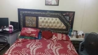 Queen size double bed with side table and dressing