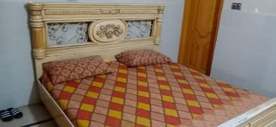 king size bed. four door cupboard and iron stand