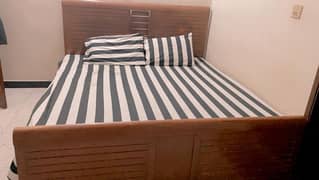 king size bed with side tables and spacious dressing table 0