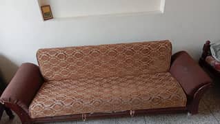 A wooden sofabed by foam