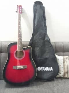 Jumbo acoustic guitar with bag and pick