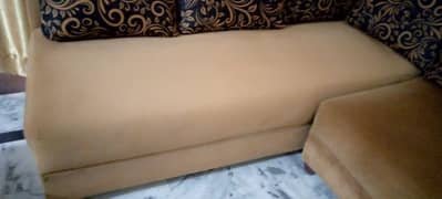 L shaped sofa golden and black color