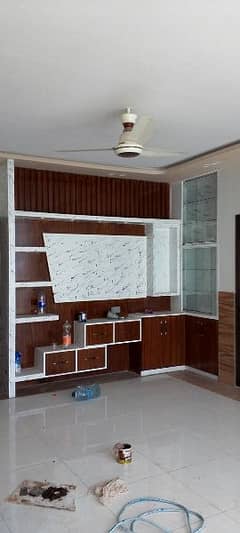 media wall and kitchen cabinets